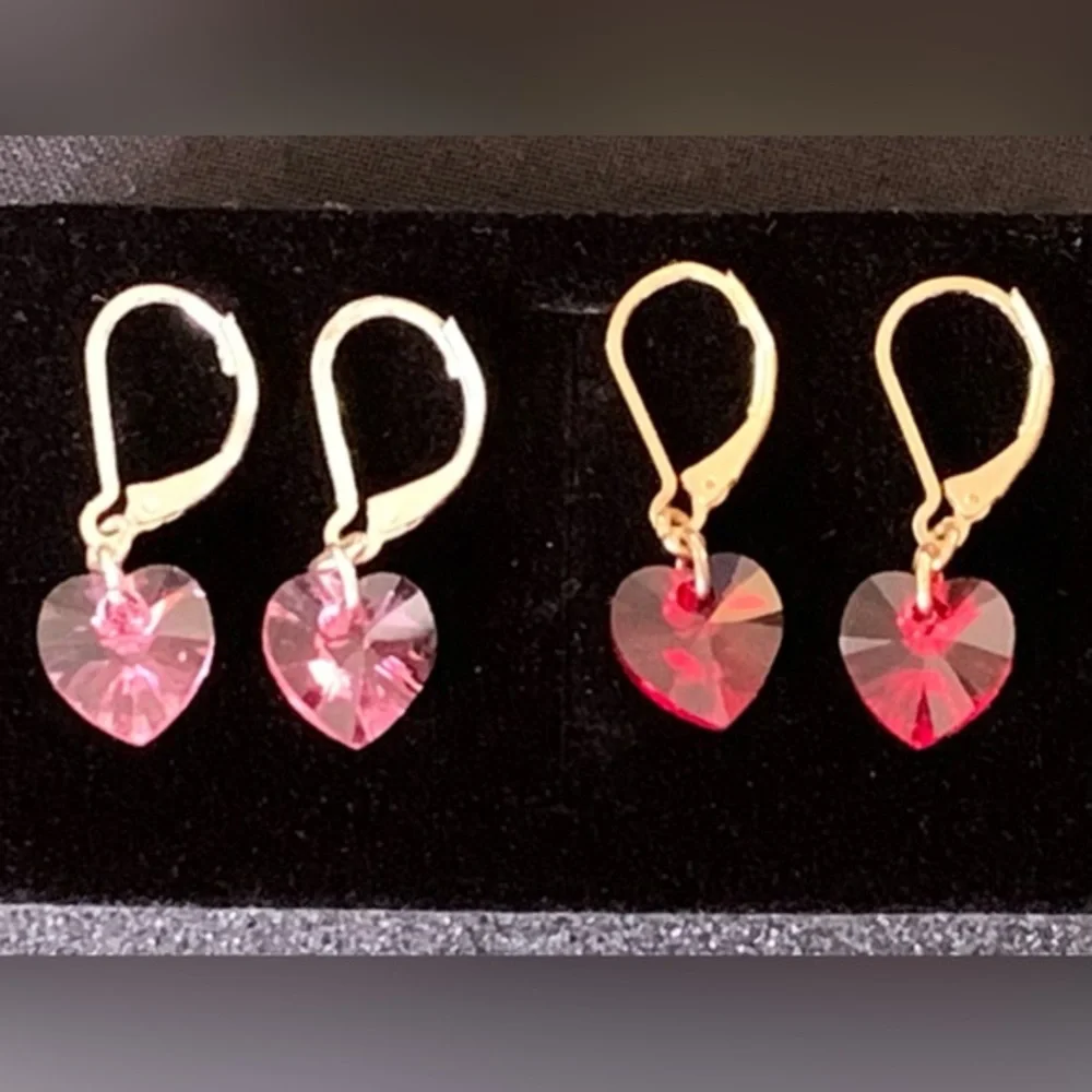 Set of two heart-shaped lever back earrings red and pink crystal